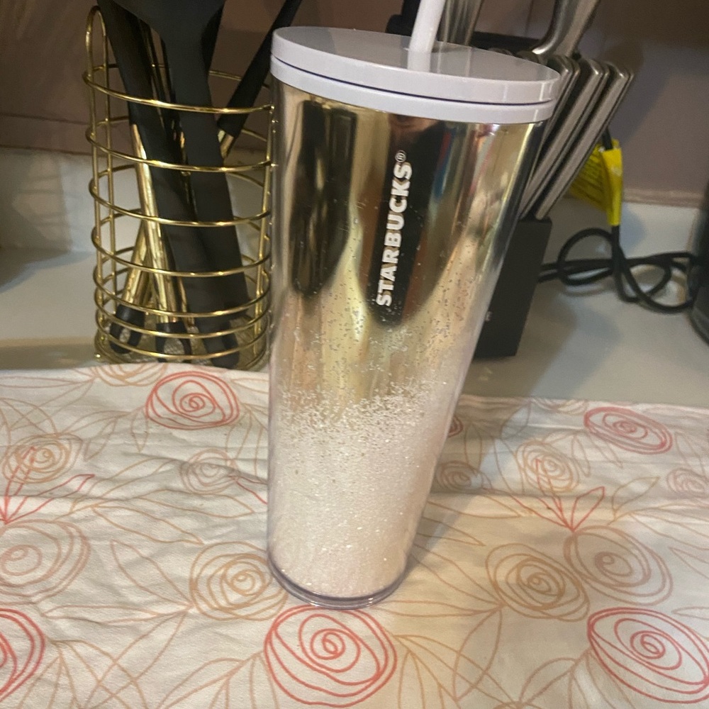 Gold and white Starbucks cup
